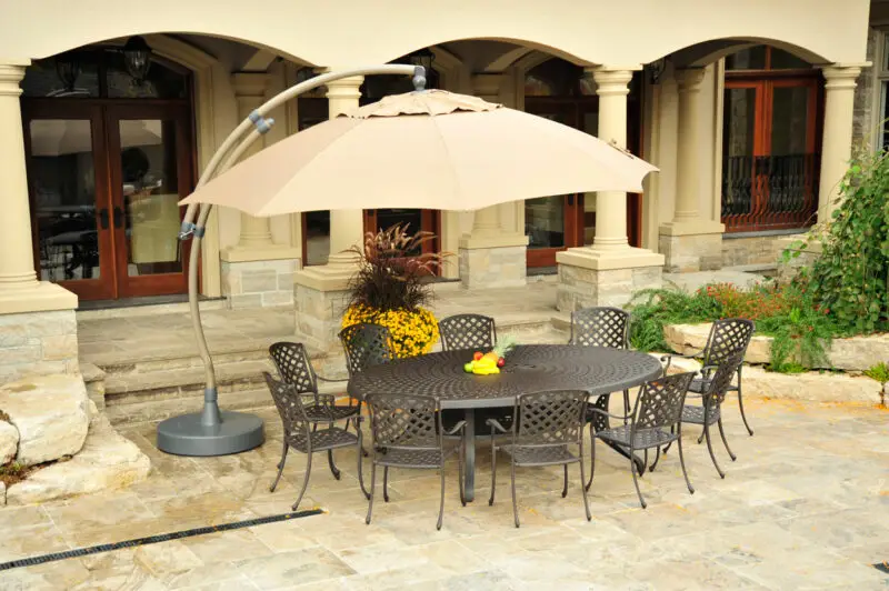 Protege Casual - Sungarden umbrella on a patio with a beautiful dining set