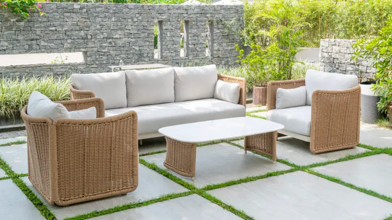 outdoor sofa and chairs in a neutral beige wicker