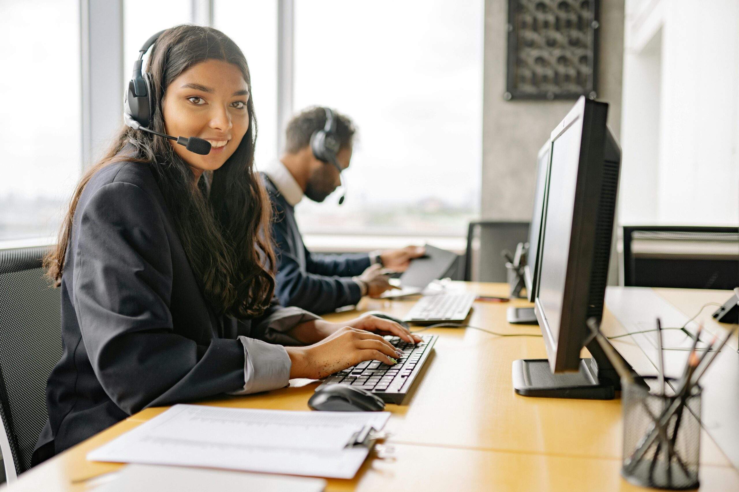 a customer service agent in front of a computer