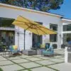 yellow cantilever umbrella covering an outdoor patio set